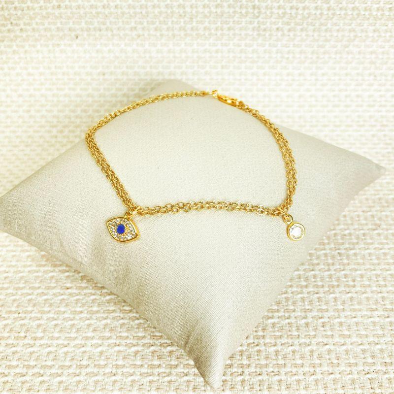 Pulseira Dupla com Pingente Olho Grego Cravedo de Microzircônias e Ponto de Luz Folheada a Ouro 18k